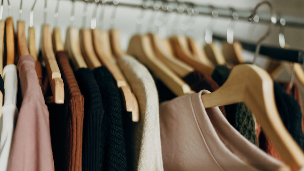 Clothes hanging in a closet