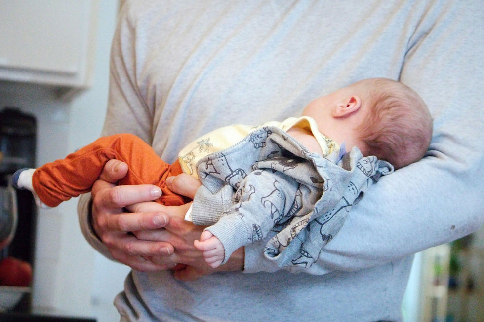 child resting securely in father's arms