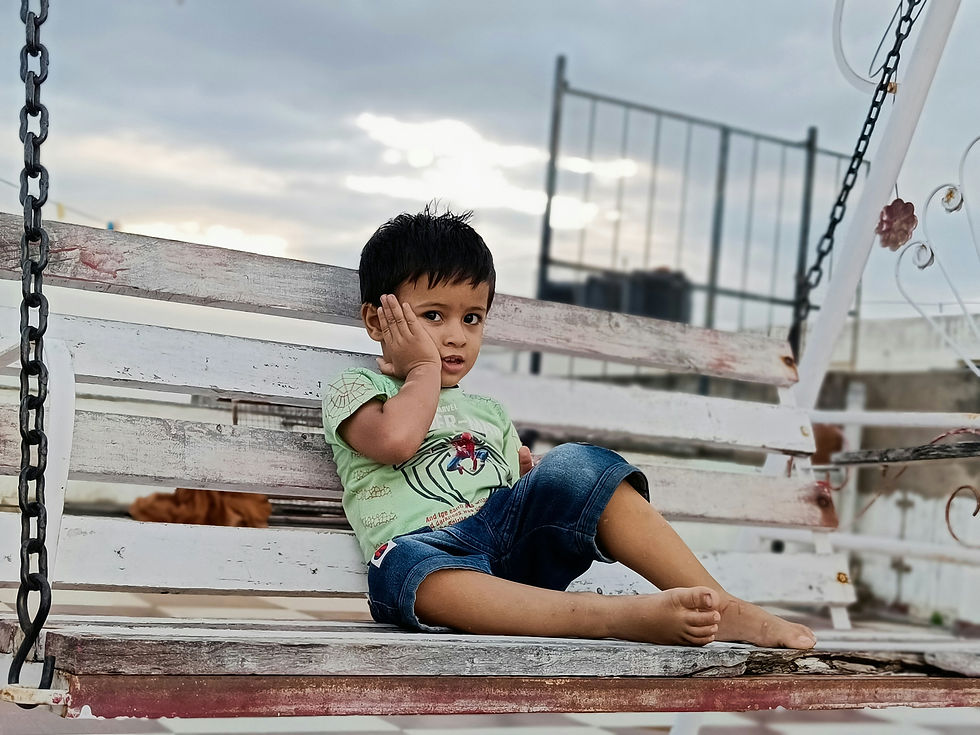 little boy on swing