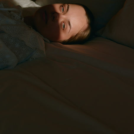 Image of a person resting with eyes closed: