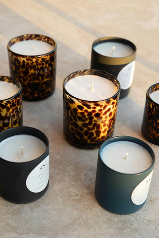 Scented candles in leopard print and matte black jars