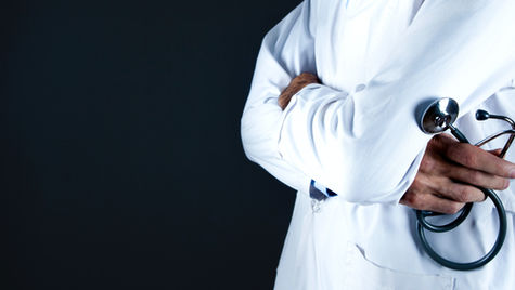 Doctor reviewing medical clinic agreement