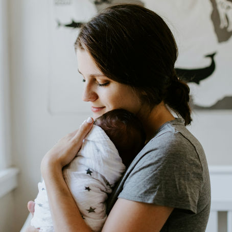 A mother holding her baby