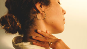 A woman experiencing a hot flash — perimenopause hot flashes are driven by KNDy neuron hyperactivation in the hypothalamus, not simply by low estrogen levels