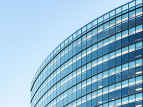 Modern glass office building, illustrating corporate dissolution and director liability under Dutch law