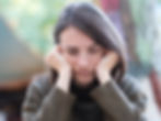 A woman feeling anxious and distraught.