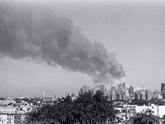 smoke billowing from city