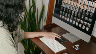 Woman reviewing her photography website without knowing it may be missing required legal compliance elements.