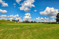 men walking on a golf course