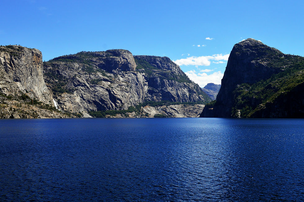 lake surounded by rocky cliffs