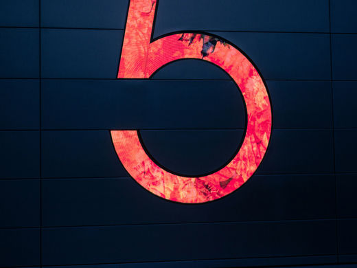 red Number 5 in black background