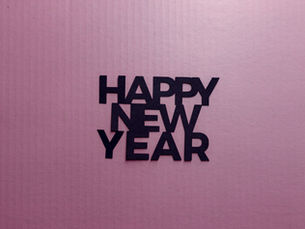 Person making small healthy lifestyle changes in December, holding a warm drink and journal. Soft wellness aesthetic. Represents starting a wellness routine now instead of waiting for the New Year, featuring clean, non toxic supplements and natural health products.