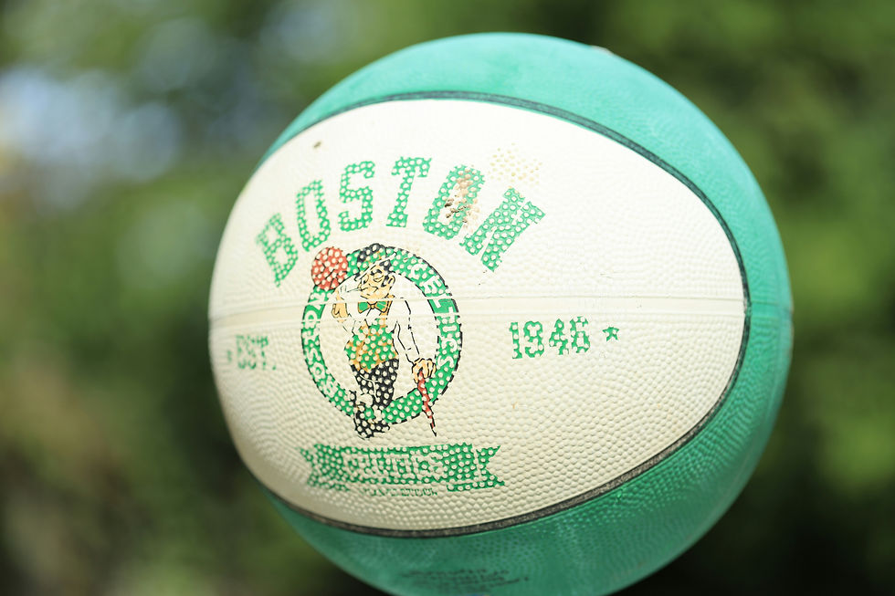 A green and white basketball with the boston celtics logo on it