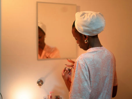 Woman practicing gentle natural skincare routine – self-care during and after cancer treatment