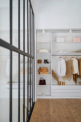 Custom built-in closet and storage solution with clean modern lines and open shelves