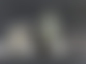 Minimal still life with a glass of milk splashing beside a milk bottle, symbolizing disruption and creative adaptation Milk splashing from a glass in a calm, minimal setup, capturing a moment of unexpected change