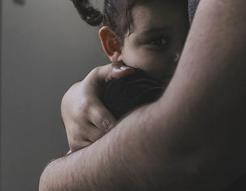 “Parent comforting child with a hug, offering reassurance and support.