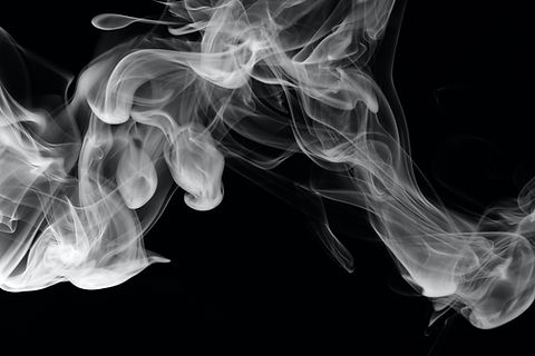 black and white image of smoke from a fire