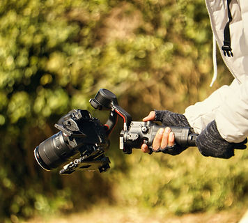 Person holding a high end video camera describing Sell Your Property section of Lagos Homes your personal real estate buyer's agent to purchase property in Portugal