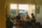 A group of friends sitting at a table enjoying a meal, Hidden Dangers of Diet Modification