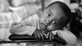 Little boy looking straight ahead