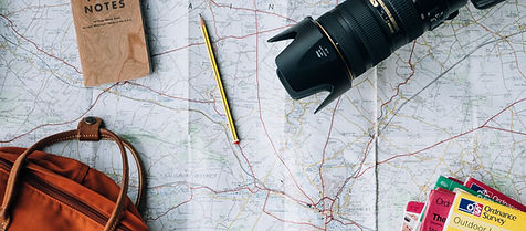 Travel essentials - map, camera and passport