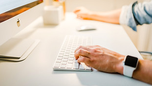 working at white computer