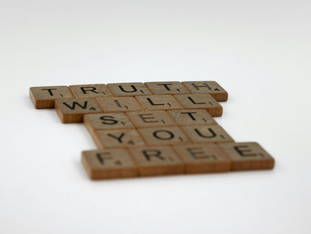 Scrabble tiles spelling out truth will set you free