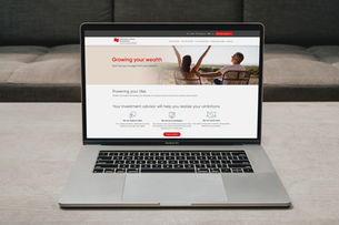 Laptop on a white table displaying a webpage titled "Science Hour 4: What's it like to live on Mars?" Nearby are a teapot and cup. Minimalist setting.