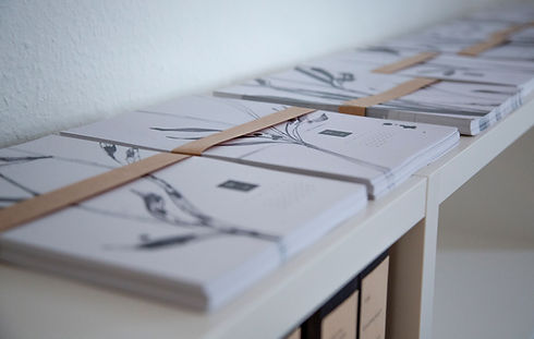 Close-up of two stacks of bound notices.