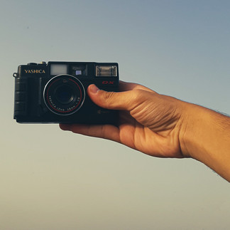 a hand taking a video with a camera