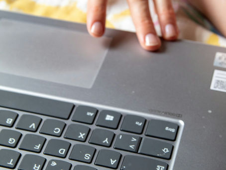 Child practising for the Cambridge Select Insight exam on a laptop, not a tablet.