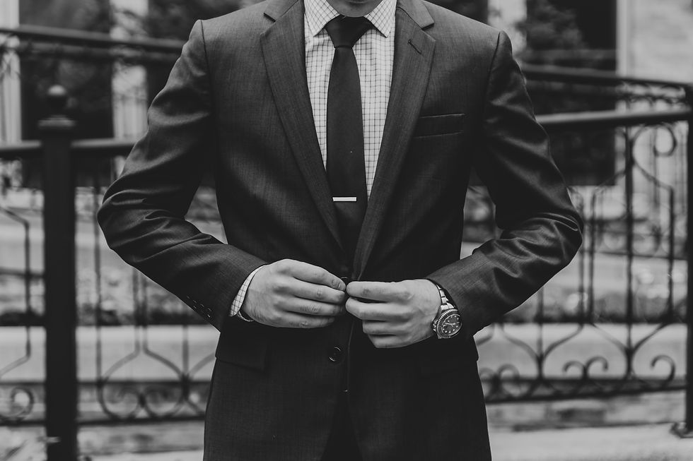 A serious injury lawyer sits confidently with a client, reviewing documents, showing trust and professionalism built on a strong legal reputation.