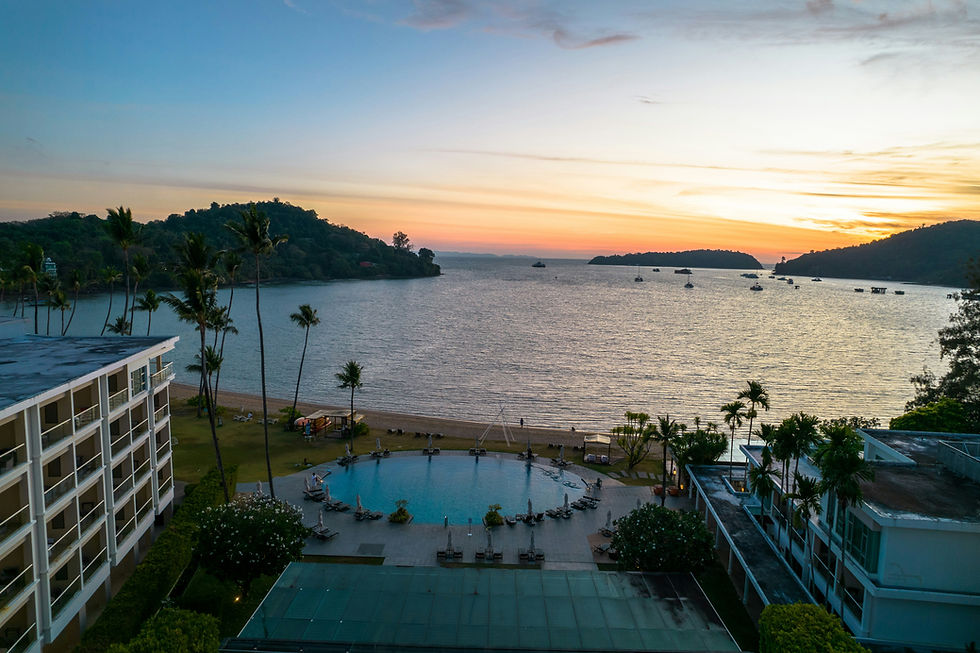 Phuket Panwa Beachfront Resort with round pool, beachfront access, and sunset views over Panwa Bay