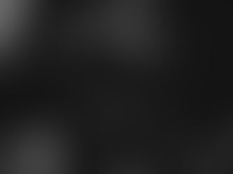 Black-and-white close-up of a woman holding a black journal with a silver lock.