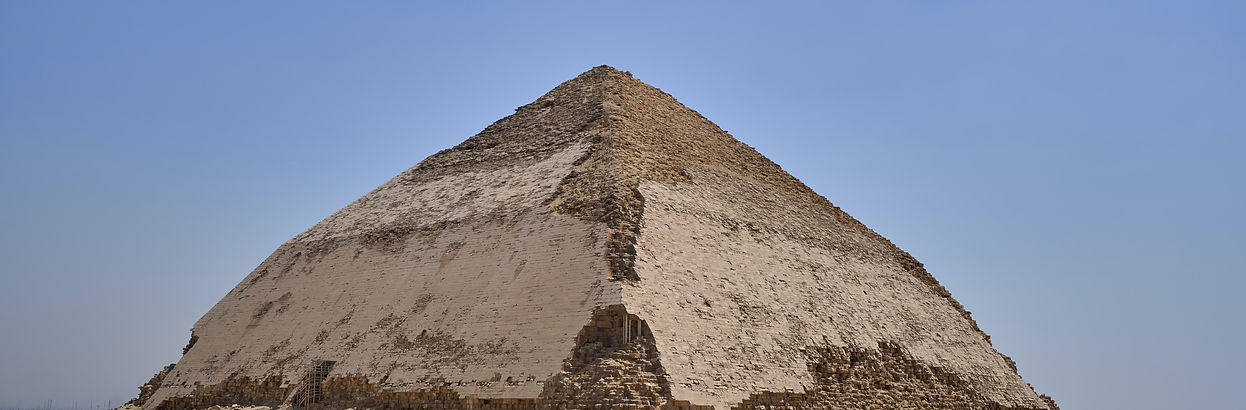 The Step Pyramid of Djoser at Sakkara, Egypt, one of the oldest pyramids in the world, standing in the desert under a clear s