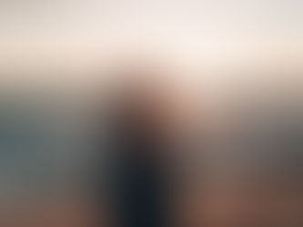 Couple on a beach in Maui at sunset on their Hawaii honeymoon