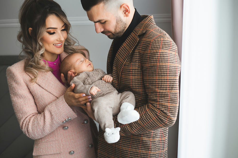 A couple holding their newborn