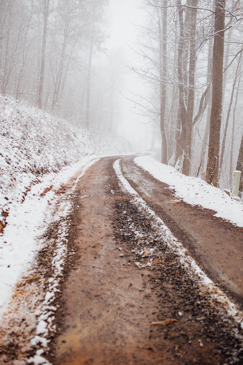 Snow-covered mountain trail leading upward, symbolizing the difficult but clarifying path of inner transformation and aligned leadership