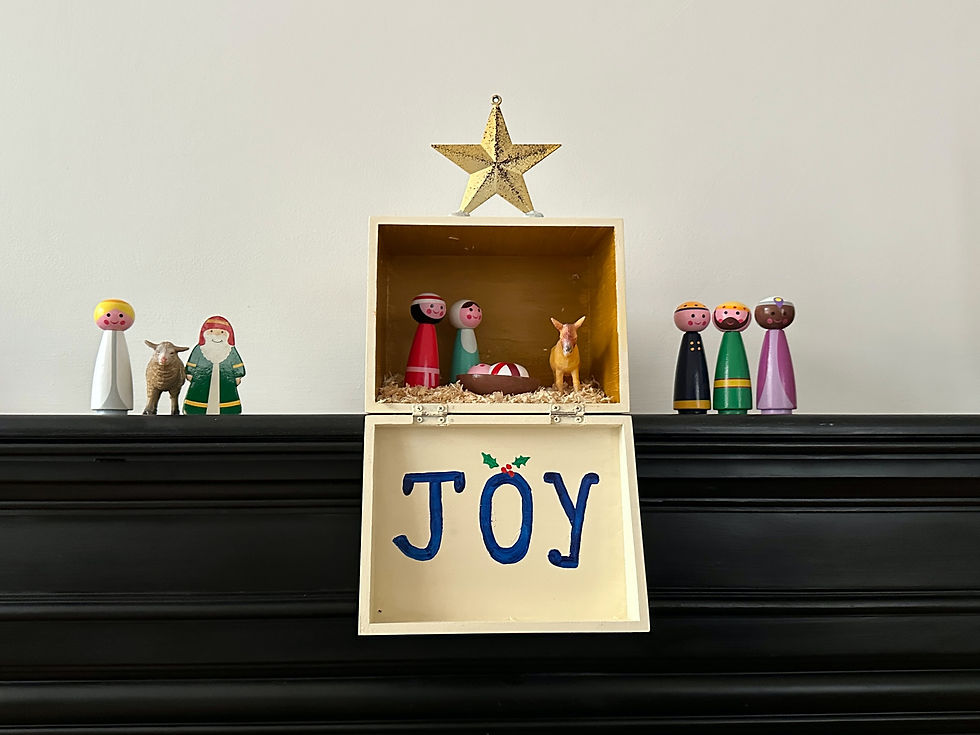 A manger with the word "Joy"