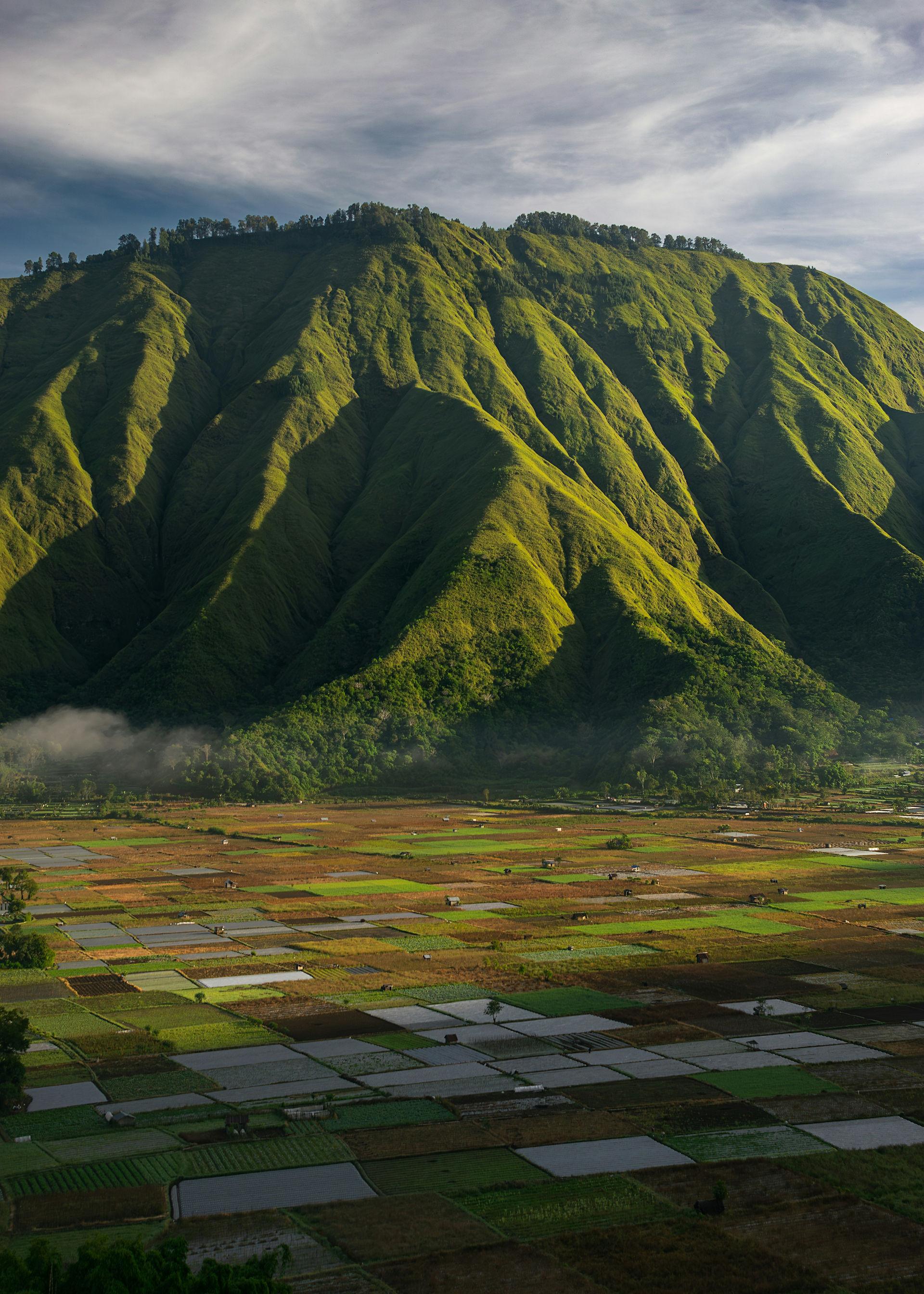 Collection of images from Lombok from green hills, diving, surfing and traditional weaving waterfall