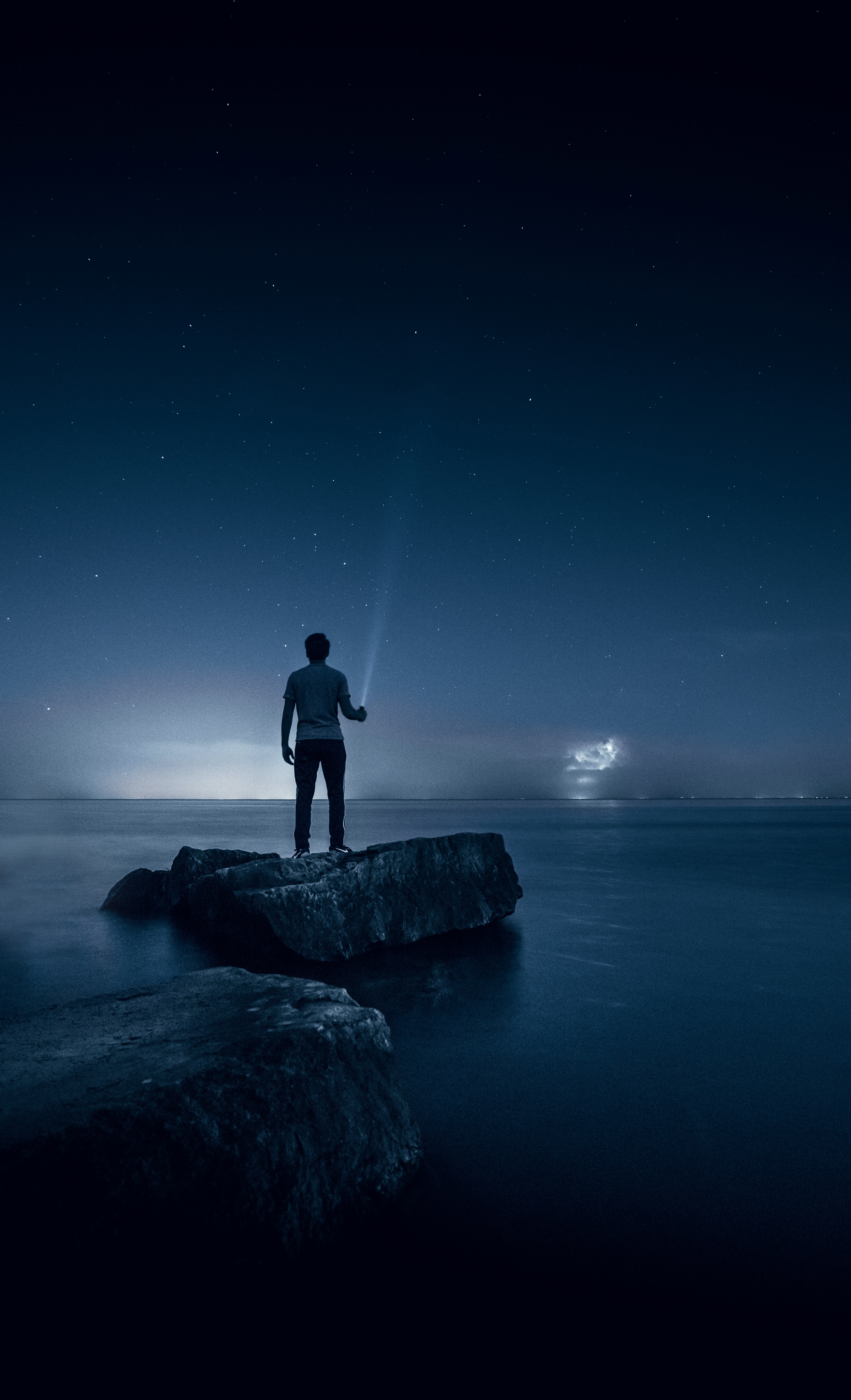 A calm Zen-like environment with smooth stones and water for stress relief.