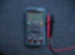 Digital Multimeter technician testing electronics investigation appliances damage lightning power surge loss claim claims adjuster insured policyholder property homeowner insurance policy voltage current resistance work