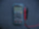 a multimeter on a dark background