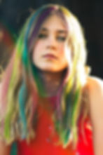 Portrait of a young woman exuding a sense of individuality and youthful vibrancy
