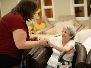 elderly woman using medicaid florida waiver program