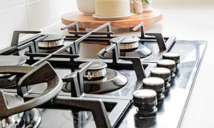 Kitchen Aid Stainless steel appliances. High end built in appliances for sale. Kitchen Aid dealer Image by Callum Hill
