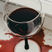 Red wine spill beside a wine glass before professional stain treatment