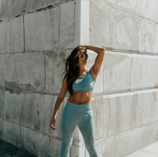GIrl in blue green gym outfit