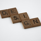 puzzle pieces with the word design spelled out